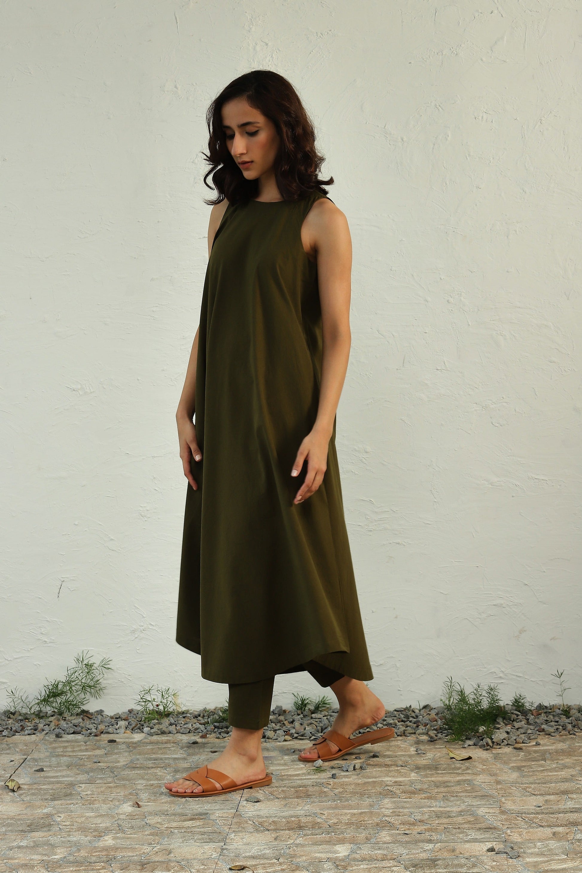 Green Sleeveless Cotton Poplin Co-Ord Set With Halter Neck by Canoopi with Canoopi, Casual Wear, Green, Indian Wear, Kurta Pant Sets, Natural, Poplin, Regular Fit, Solids, Womenswear at Kamakhyaa for sustainable fashion