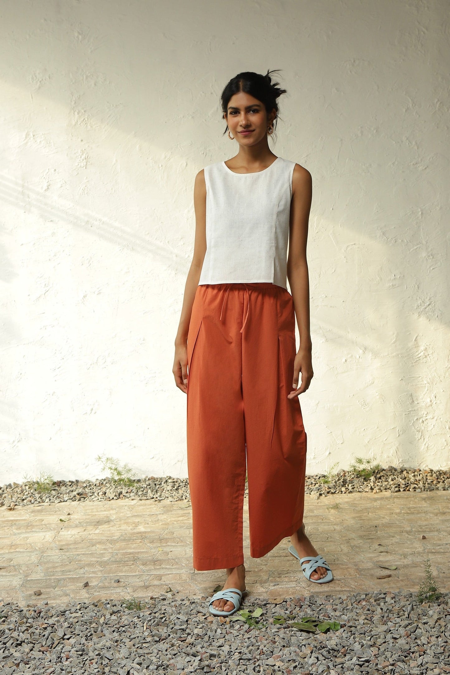 White Cotton Front Slit Top With Orange Palazzo Co-Ord Set by Canoopi with Canoopi, Casual Wear, Complete Sets, Khadi, Natural, Orange, Poplin, Regular Fit, Solids, Vacation Co-ords, White, Womenswear at Kamakhyaa for sustainable fashion