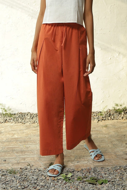 White Cotton Front Slit Top With Orange Palazzo Co-Ord Set by Canoopi with Canoopi, Casual Wear, Complete Sets, Khadi, Natural, Orange, Poplin, Regular Fit, Solids, Vacation Co-ords, White, Womenswear at Kamakhyaa for sustainable fashion