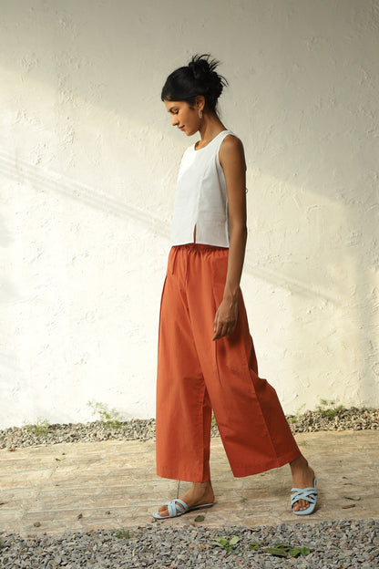 White Cotton Front Slit Top With Orange Palazzo Co-Ord Set by Canoopi with Canoopi, Casual Wear, Complete Sets, Khadi, Natural, Orange, Poplin, Regular Fit, Solids, Vacation Co-ords, White, Womenswear at Kamakhyaa for sustainable fashion