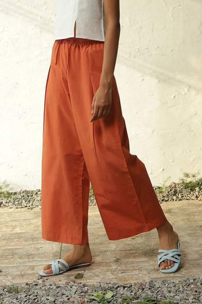 White Cotton Front Slit Top With Orange Palazzo Co-Ord Set by Canoopi with Canoopi, Casual Wear, Complete Sets, Khadi, Natural, Orange, Poplin, Regular Fit, Solids, Vacation Co-ords, White, Womenswear at Kamakhyaa for sustainable fashion