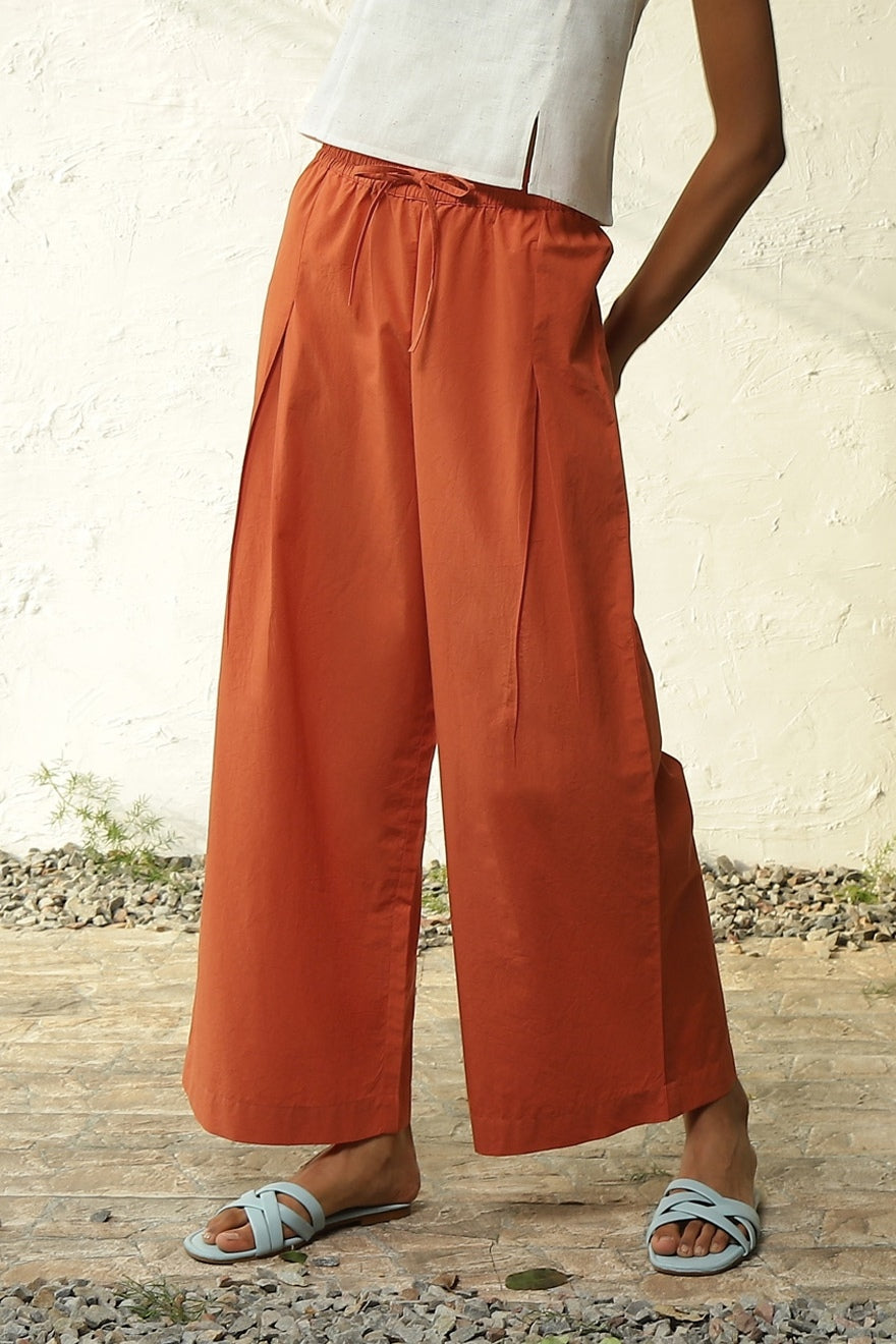 White Cotton Front Slit Top With Orange Palazzo Co-Ord Set by Canoopi with Canoopi, Casual Wear, Complete Sets, Khadi, Natural, Orange, Poplin, Regular Fit, Solids, Vacation Co-ords, White, Womenswear at Kamakhyaa for sustainable fashion