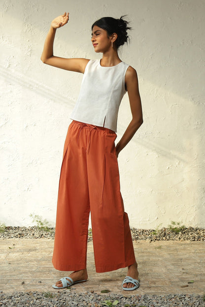 White Cotton Front Slit Top With Orange Palazzo Co-Ord Set by Canoopi with Canoopi, Casual Wear, Complete Sets, Khadi, Natural, Orange, Poplin, Regular Fit, Solids, Vacation Co-ords, White, Womenswear at Kamakhyaa for sustainable fashion