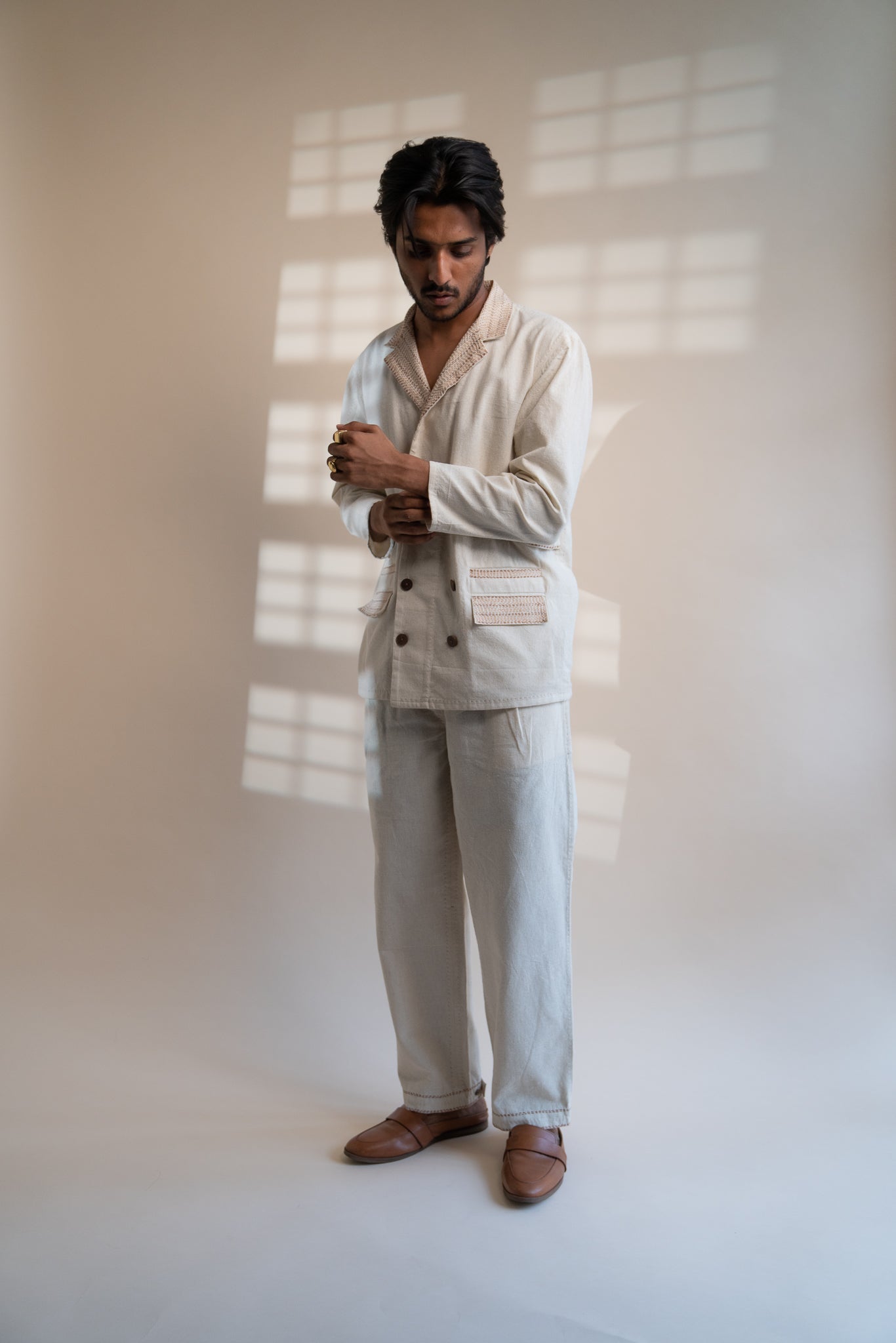 Dawning Unisex Double Breasted Jacket & Pleated Pants Set at Kamakhyaa by Lafaani. This item is Beige, Bottoms, Casual Wear, Co-ord Sets, Denim, Embroidered, For Him, Hand Woven Cotton, Kora, Mens Co-ords, Menswear, Natural, Regular Fit, Unisex