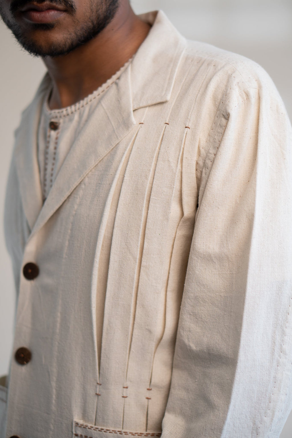 Dawning Unisex Pleated Blazer by Lafaani with Beige, Blazers, Casual Wear, Dawning by Lafaani, Denim, Embroidered, For Him, Hand Woven Cotton, Kora, Mens Overlay, Menswear, Natural, Regular Fit, Unisex at Kamakhyaa for sustainable fashion