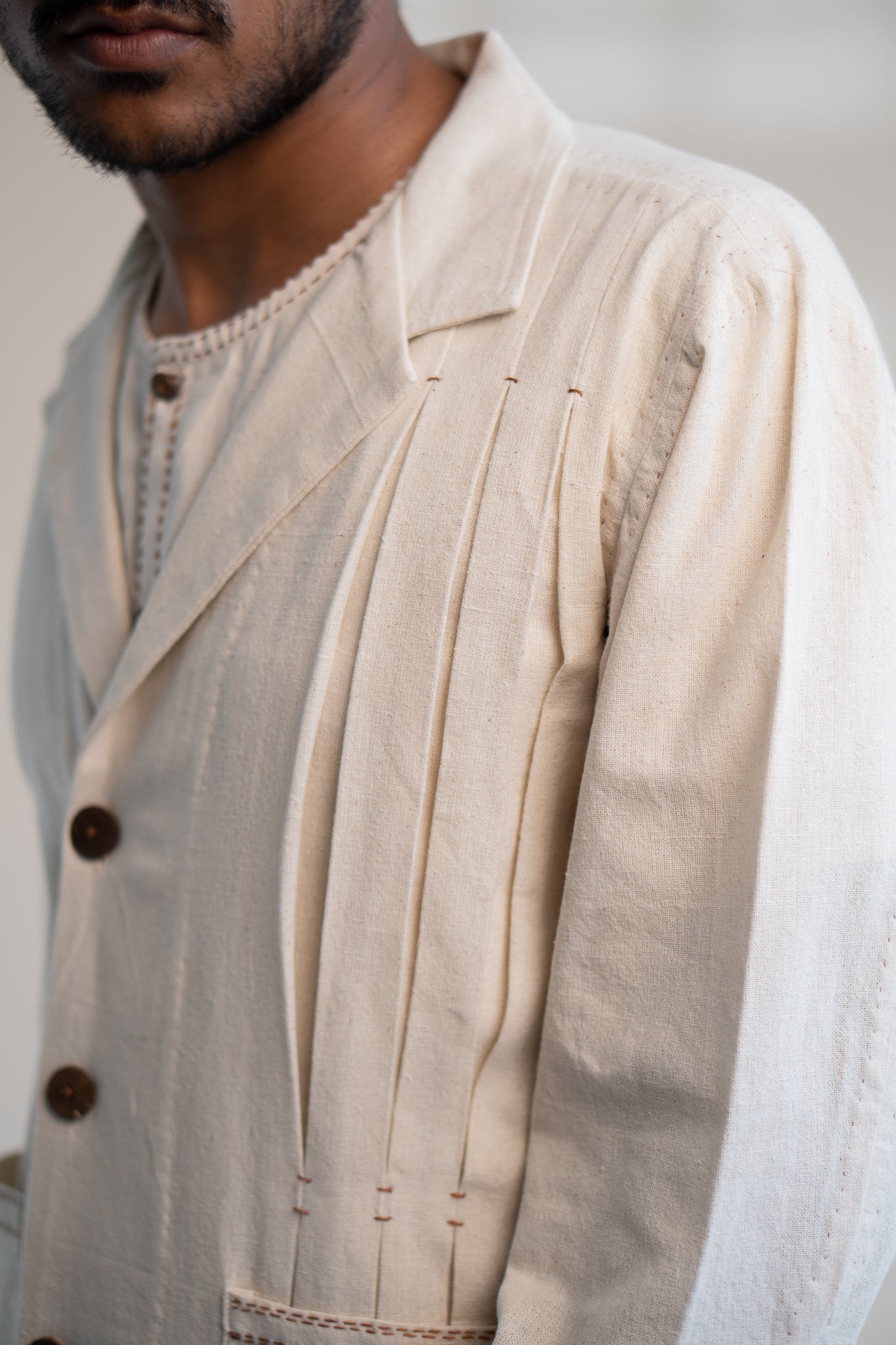 Dawning Unisex Pleated Blazer by Lafaani with Beige, Blazers, Casual Wear, Dawning by Lafaani, Denim, Embroidered, For Him, Hand Woven Cotton, Kora, Mens Overlay, Menswear, Natural, Regular Fit, Unisex at Kamakhyaa for sustainable fashion