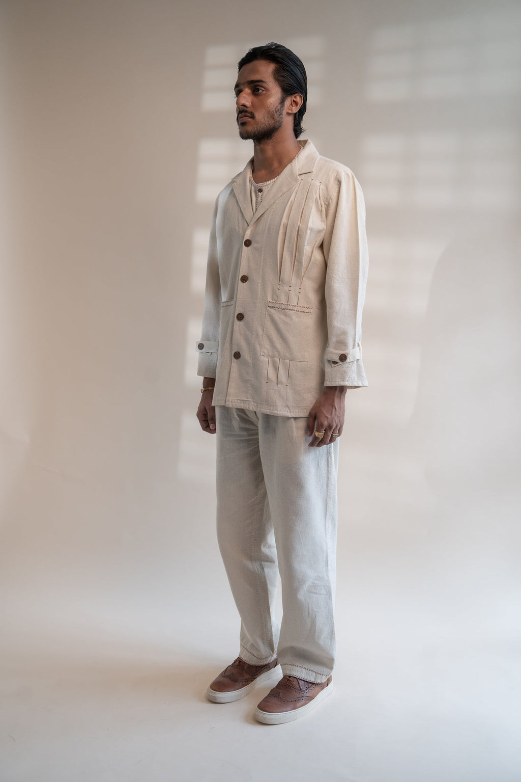 Dawning Unisex Pleated Blazer by Lafaani with Beige, Blazers, Casual Wear, Dawning by Lafaani, Denim, Embroidered, For Him, Hand Woven Cotton, Kora, Mens Overlay, Menswear, Natural, Regular Fit, Unisex at Kamakhyaa for sustainable fashion