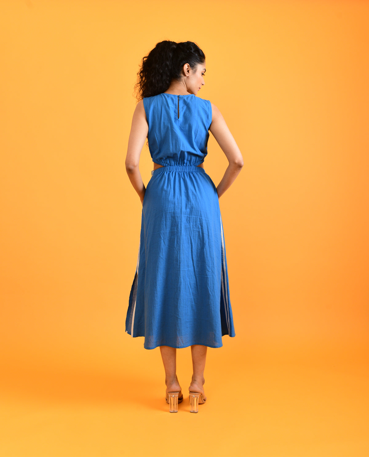 Blue Midi Dress at Kamakhyaa by Rias Jaipur. This item is Blue, Casual Wear, Cut Out Dresses, Handloom Cotton, Handspun, Handwoven, Hue, Midi Dresses, Sleeveless Dresses, Slim Fit, Solids, Stripes, Womenswear
