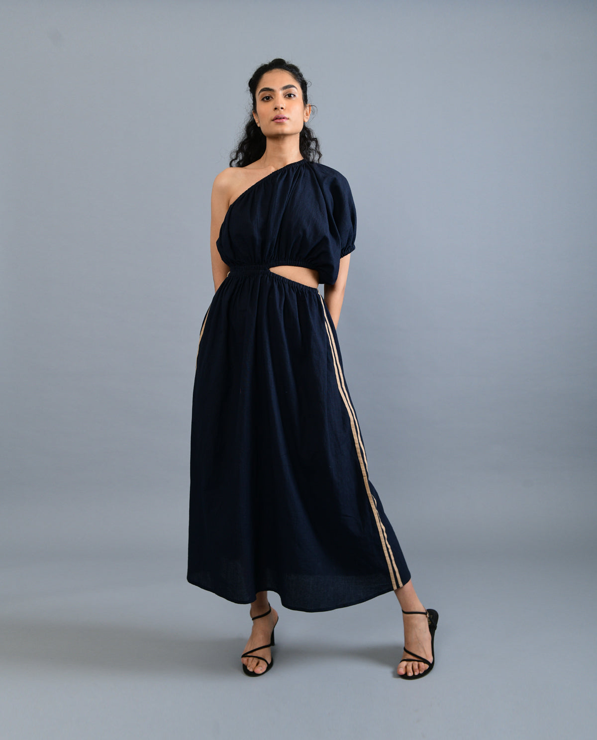 Black Solid Midi Dress at Kamakhyaa by Rias Jaipur. This item is Black, Casual Wear, Handloom Cotton, Handspun, Handwoven, Hue, Midi Dresses, One Shoulder Dresses, Relaxed Fit, Solids, Stripes, Womenswear