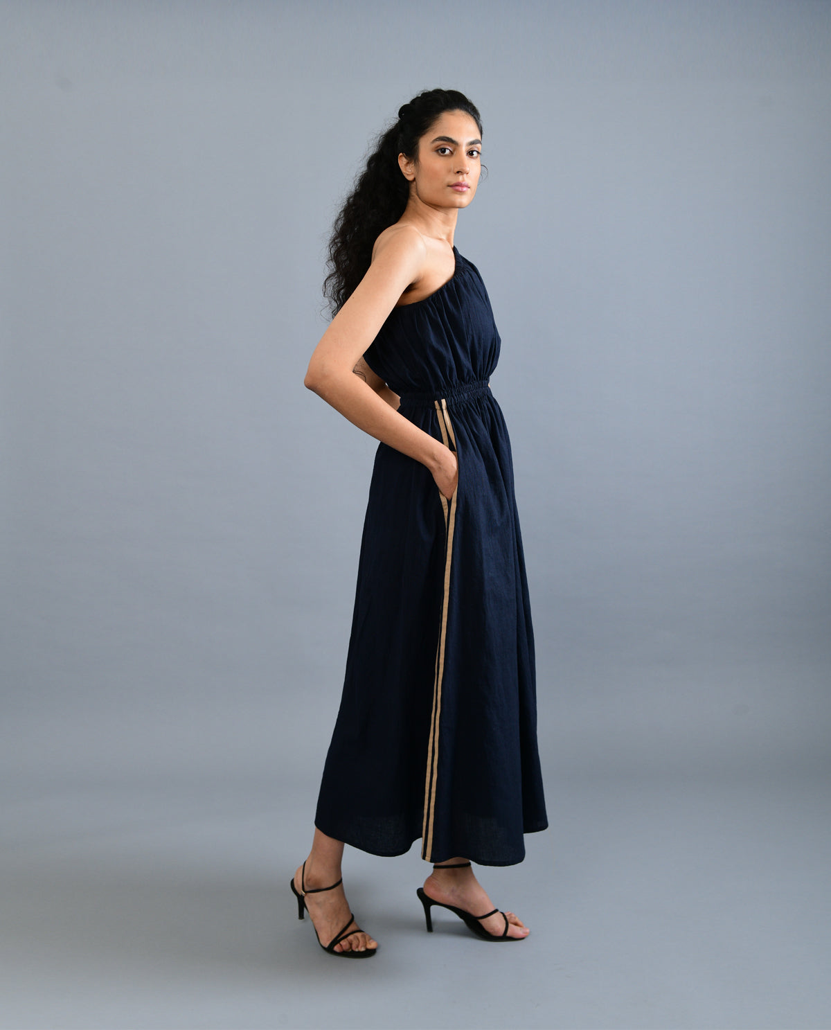 Black Solid Midi Dress at Kamakhyaa by Rias Jaipur. This item is Black, Casual Wear, Handloom Cotton, Handspun, Handwoven, Hue, Midi Dresses, One Shoulder Dresses, Relaxed Fit, Solids, Stripes, Womenswear
