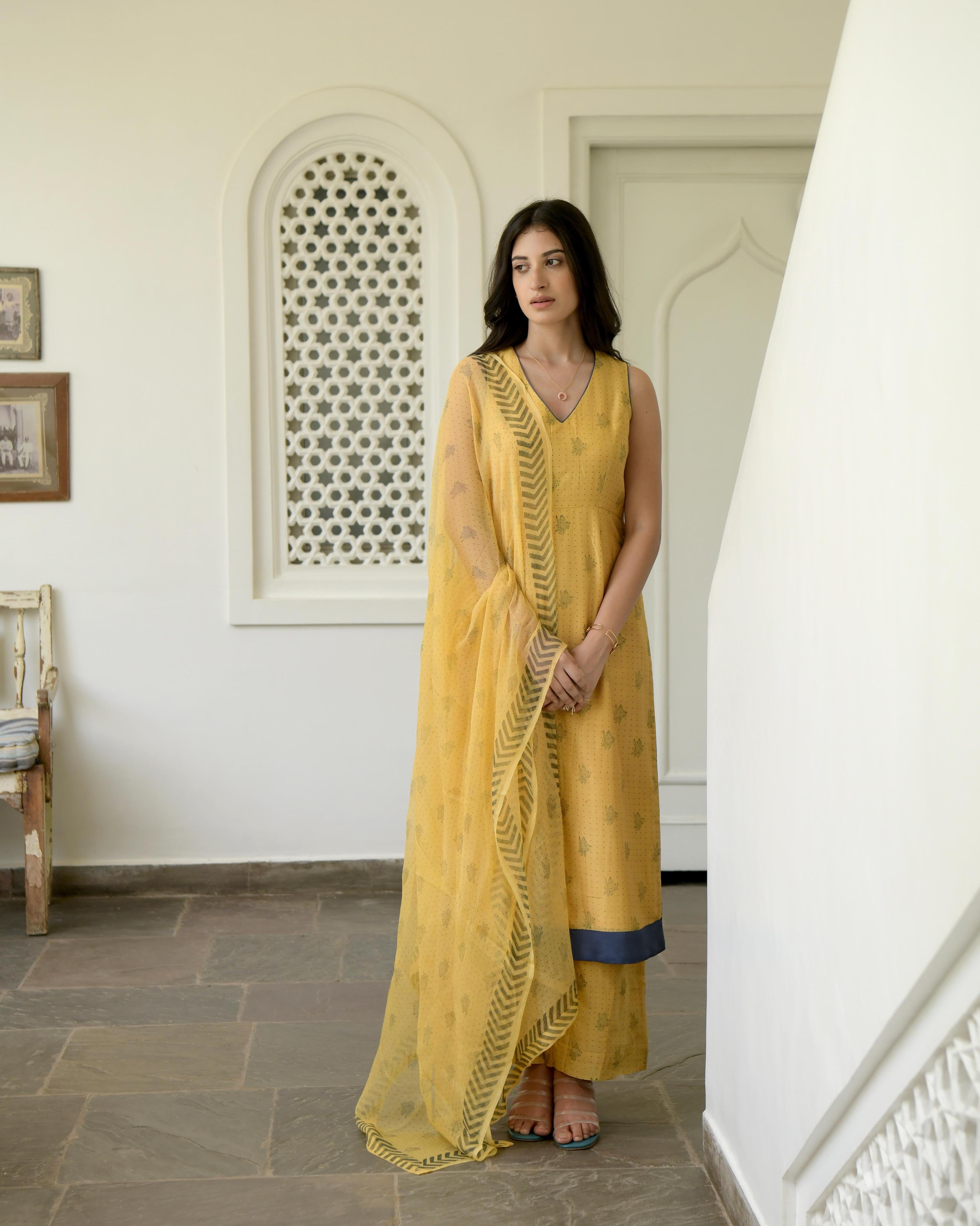 Yellow Sleeveless Chanderi Silk Kurta Set With Dupatta by Taro with Best Selling, Evening Wear, Gulzar by Taro, Handwoven Chanderi silk, Indian Wear, July Sale, July Sale 2023, Kurta Pant Sets, Kurta Set With Dupatta, Natural, Prints, Regular Fit, Womenswear, Yellow at Kamakhyaa for sustainable fashion
