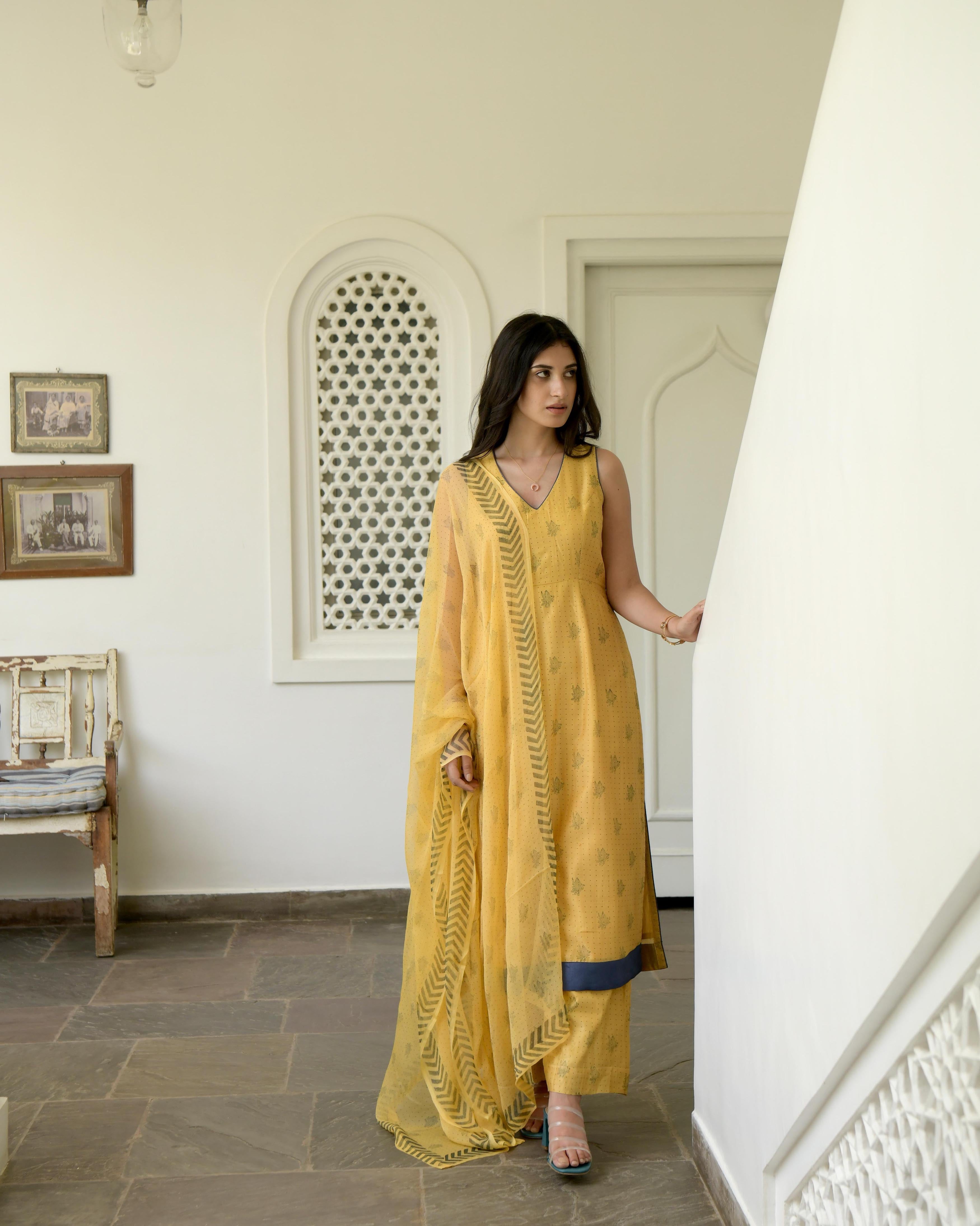 Yellow Sleeveless Chanderi Silk Kurta Set With Dupatta by Taro with Best Selling, Evening Wear, Gulzar by Taro, Handwoven Chanderi silk, Indian Wear, July Sale, July Sale 2023, Kurta Pant Sets, Kurta Set With Dupatta, Natural, Prints, Regular Fit, Womenswear, Yellow at Kamakhyaa for sustainable fashion