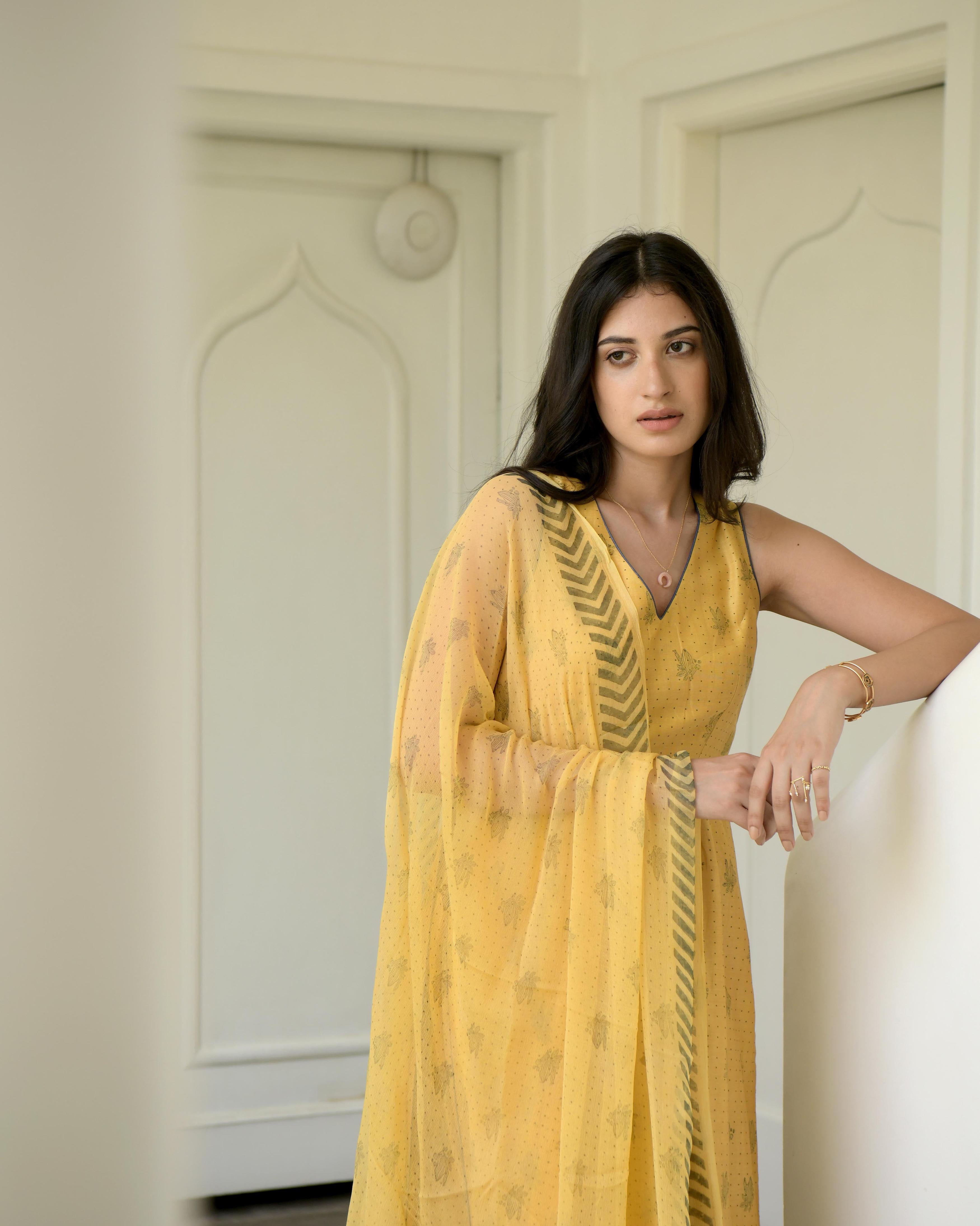 Yellow Sleeveless Chanderi Silk Kurta Set With Dupatta by Taro with Best Selling, Evening Wear, Gulzar by Taro, Handwoven Chanderi silk, Indian Wear, July Sale, July Sale 2023, Kurta Pant Sets, Kurta Set With Dupatta, Natural, Prints, Regular Fit, Womenswear, Yellow at Kamakhyaa for sustainable fashion