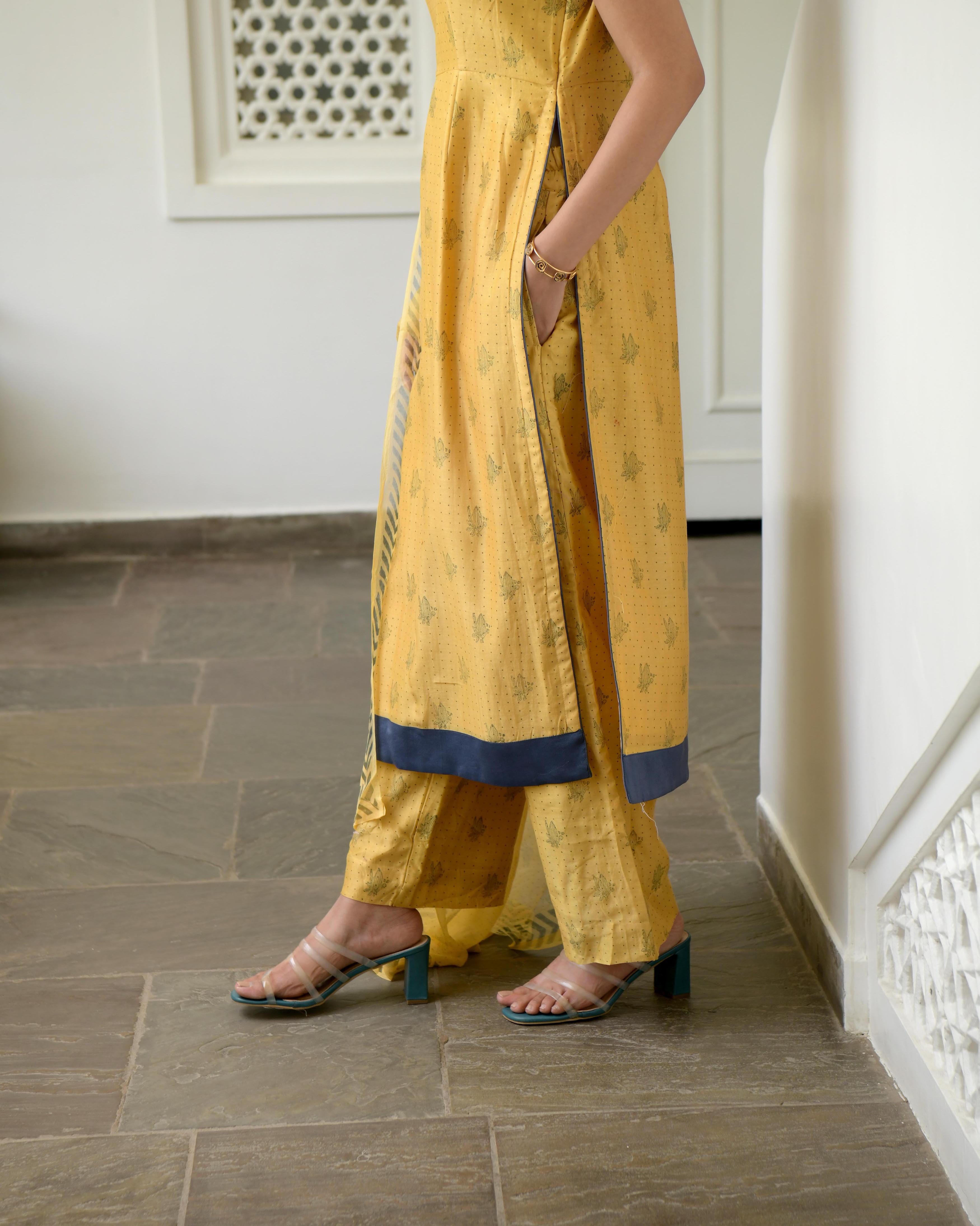 Yellow Sleeveless Chanderi Silk Kurta Set With Dupatta by Taro with Best Selling, Evening Wear, Gulzar by Taro, Handwoven Chanderi silk, Indian Wear, July Sale, July Sale 2023, Kurta Pant Sets, Kurta Set With Dupatta, Natural, Prints, Regular Fit, Womenswear, Yellow at Kamakhyaa for sustainable fashion
