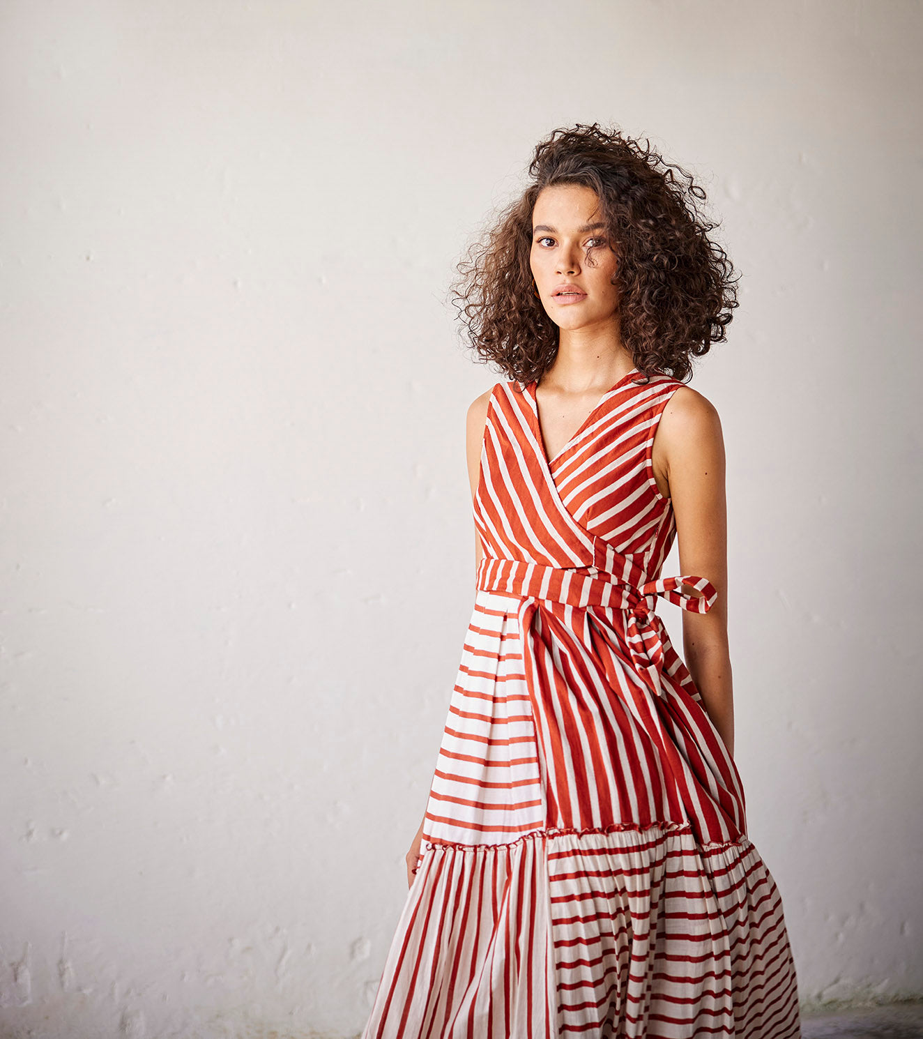 Red And Off White Stripped Mulmul Frilled Dress by Khara Kapas with An Indian Summer, An Indian Summer by Khara Kapas, Casual Wear, Dresses, Mulmul cotton, Off white, Orange, Organic, Relaxed Fit, Stripes, Womenswear at Kamakhyaa for sustainable fashion