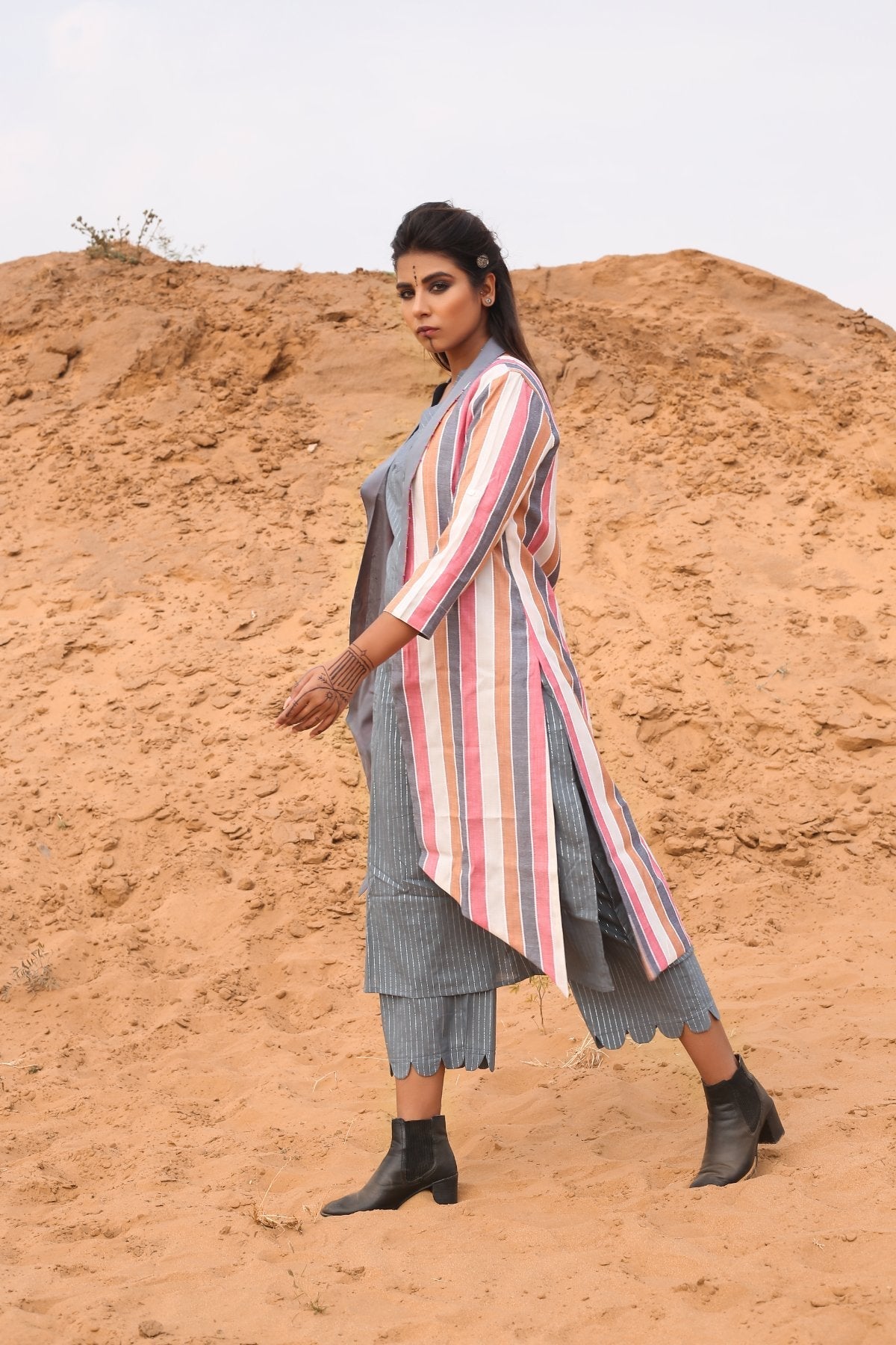 Multi-Color Striped Cape With Kurta And Pants - Set Of Three by Keva with Cape, Co-ord Sets, Cotton, Cotton Lurex, Desert Rose, Multicolor, Natural, Relaxed Fit, Resort Wear, Stripes, Travel, Travel Co-ords, Womenswear at Kamakhyaa for sustainable fashion
