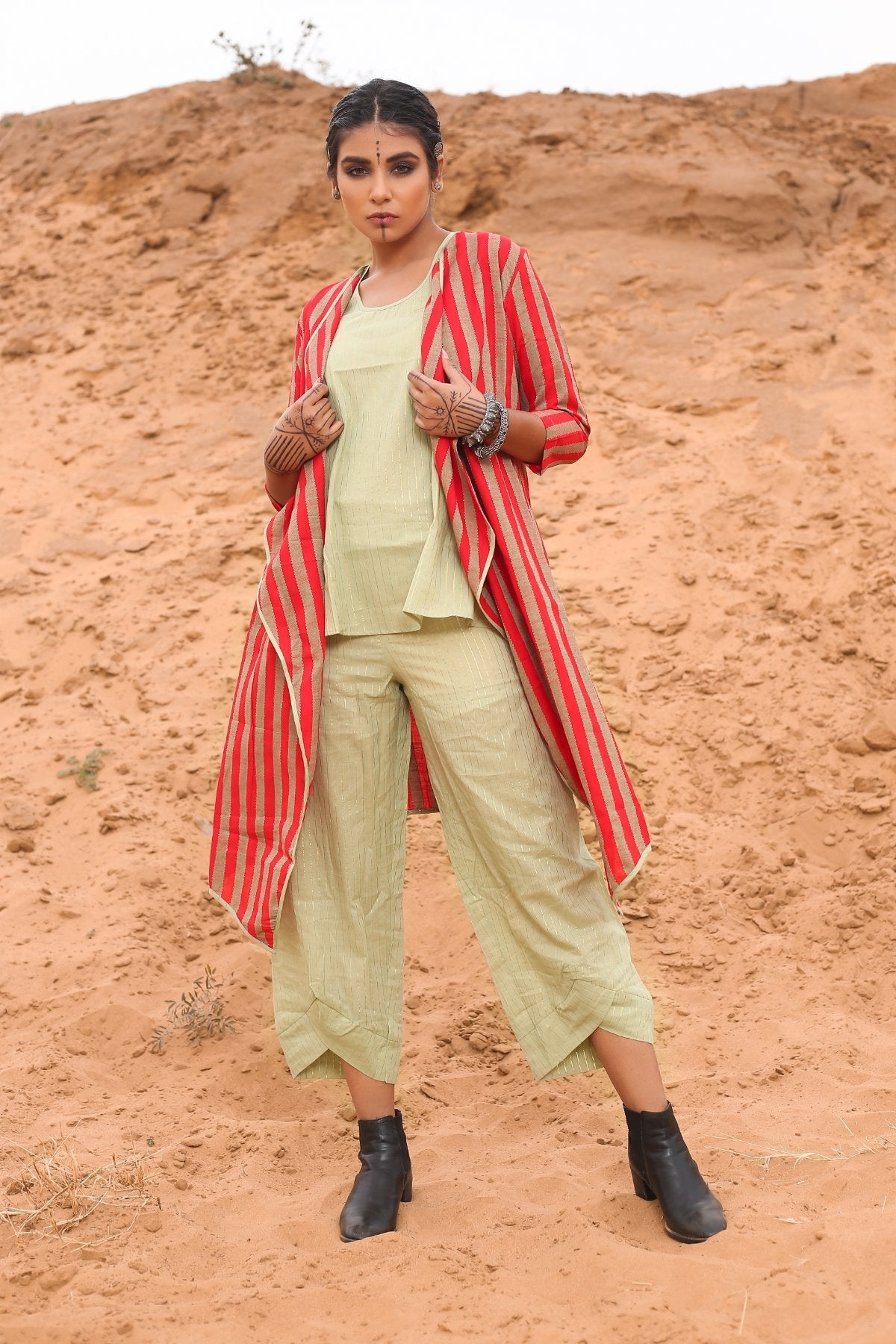 Top With Pants And Red Striped Cape - Set Of Three by Keva with Cape, Co-ord Sets, Cotton, Cotton Lurex, Desert Rose, Natural, Office Wear Co-ords, Red, Relaxed Fit, Resort Wear, Stripes, Travel, Travel Co-ords, Womenswear at Kamakhyaa for sustainable fashion