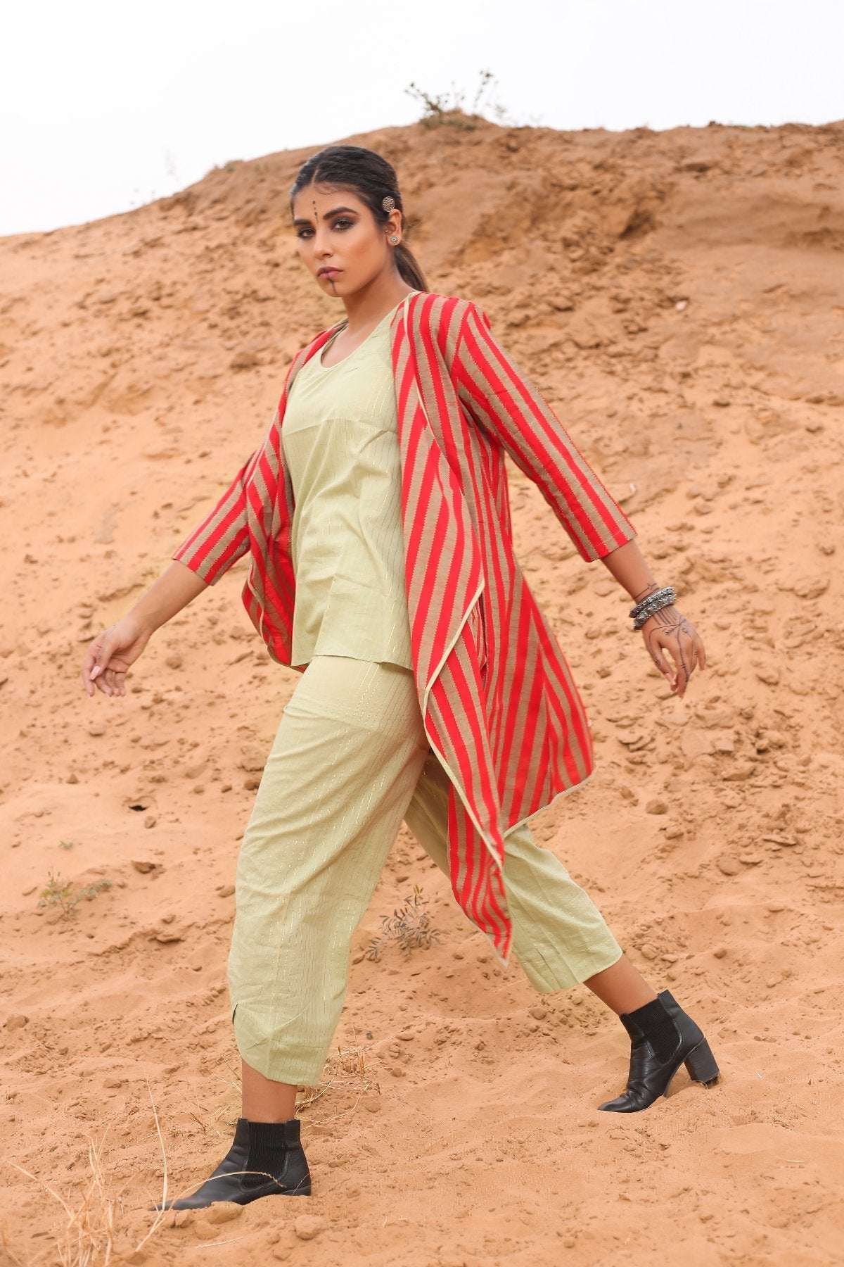 Top With Pants And Red Striped Cape - Set Of Three by Keva with Cape, Co-ord Sets, Cotton, Cotton Lurex, Desert Rose, Natural, Office Wear Co-ords, Red, Relaxed Fit, Resort Wear, Stripes, Travel, Travel Co-ords, Womenswear at Kamakhyaa for sustainable fashion