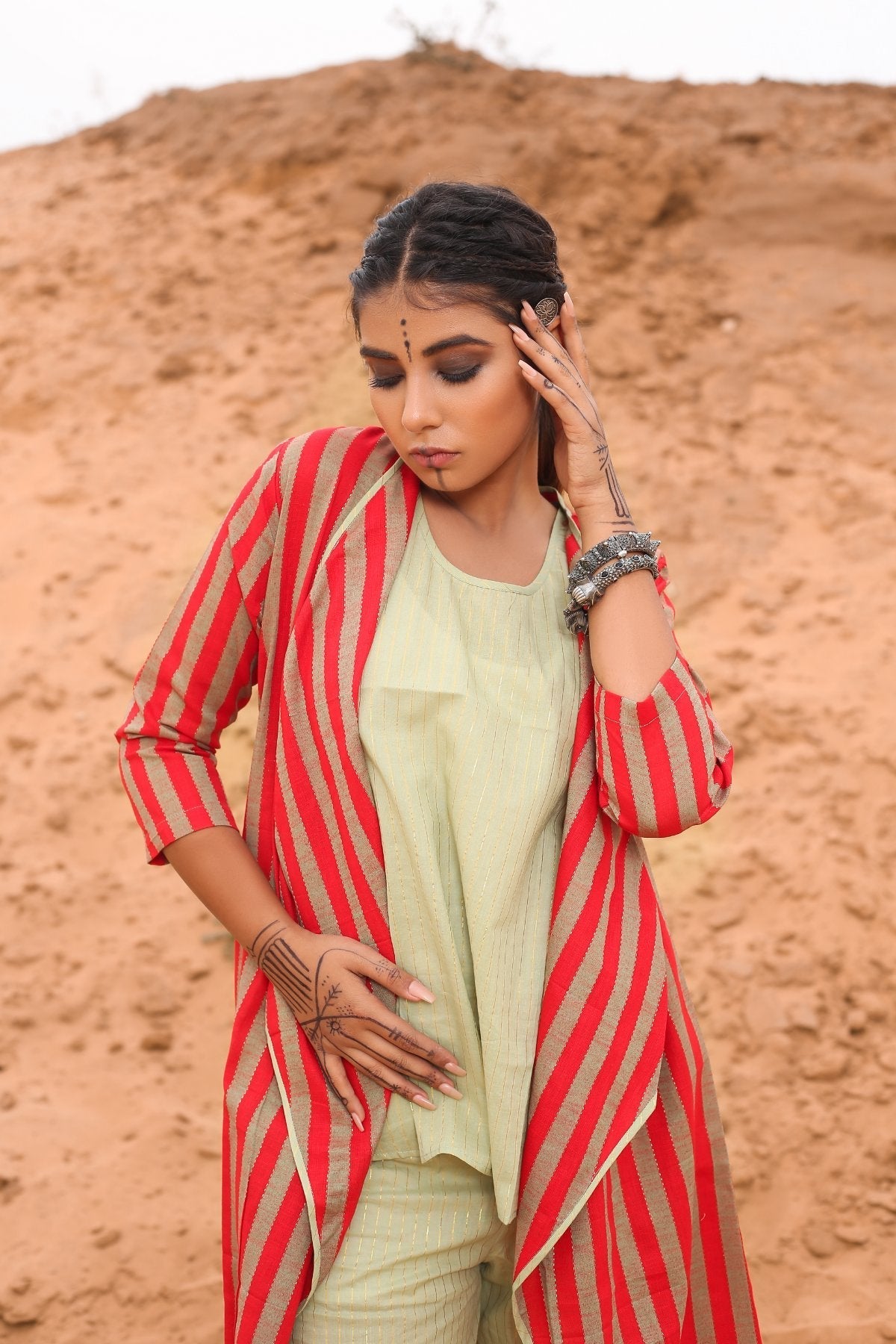 Top With Pants And Red Striped Cape - Set Of Three by Keva with Cape, Co-ord Sets, Cotton, Cotton Lurex, Desert Rose, Natural, Office Wear Co-ords, Red, Relaxed Fit, Resort Wear, Stripes, Travel, Travel Co-ords, Womenswear at Kamakhyaa for sustainable fashion