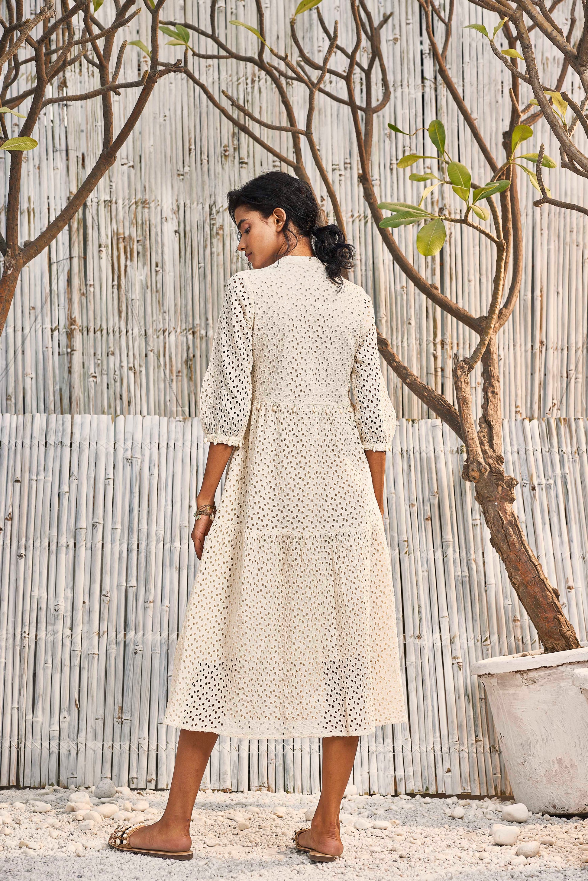 Breezy Cotton Cutwork Ivory Dress by Charkhee with Best Selling, Cotton, Cutwork, Kurtas, Midi Dresses, Natural, Regular Fit, Resort Wear, Schiffli, Shores 23, Textured, Tiered Dresses, White, Womenswear at Kamakhyaa for sustainable fashion