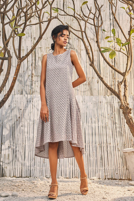 Steel Grey High-Low Cutwork Flared Dress by Charkhee with Best Selling, Cotton, Festive Wear, Grey, Midi Dresses, Natural, Regular Fit, Schiffli, Shores 23, Sleeveless Dresses, Textured, Womenswear at Kamakhyaa for sustainable fashion