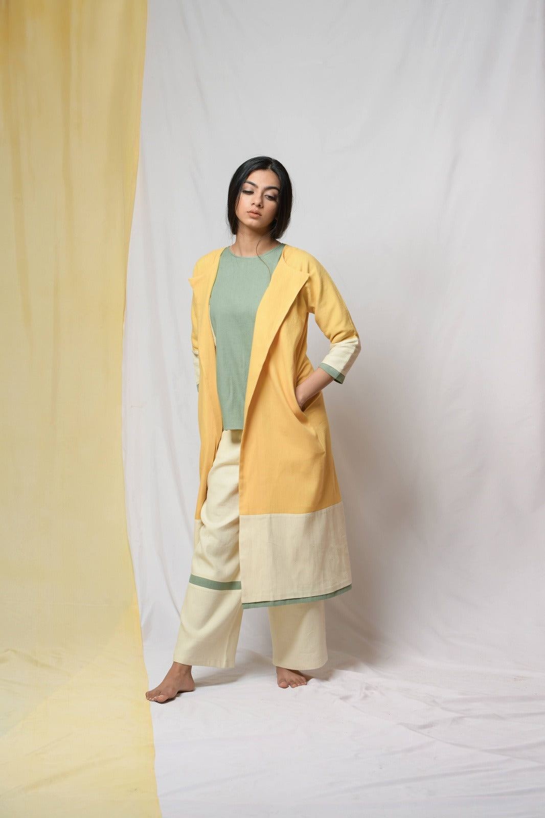 Yellow Roving Dunes Jacket by Niraa with Coats, Cotton khadi, Evening Wear, Natural with azo dyes, Relaxed Fit, Solids, Tales of rippling brooks, Womenswear, Yellow at Kamakhyaa for sustainable fashion