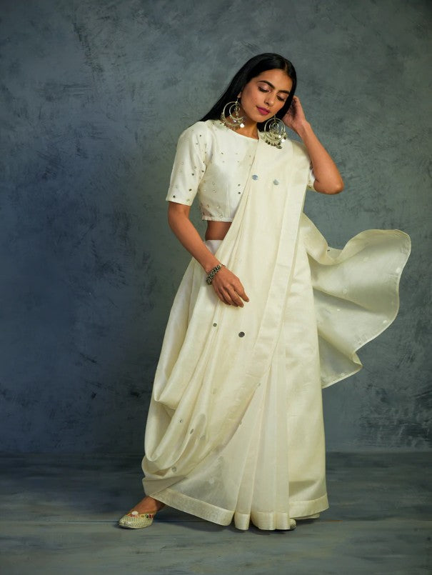 Chanderi Off-white Saree With Off-white Blouse by Charkhee with Chanderi, Cotton, Embellished, Ethnic Wear, Indian Wear, Mirror Work, Natural, Relaxed Fit, Saree Sets, Tyohaar by Charkhee, White, Womenswear at Kamakhyaa for sustainable fashion