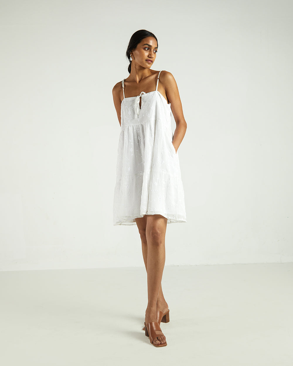 White Sleeveless Tier Dress by Reistor with A Summer Situation by Reistor, Bemberg, Best Selling, Casual Wear, Chiffon, FB ADS JUNE, Highend fashion, Mini Dresses, Natural, Sleeveless Dresses, Solids, White, Womenswear at Kamakhyaa for sustainable fashion