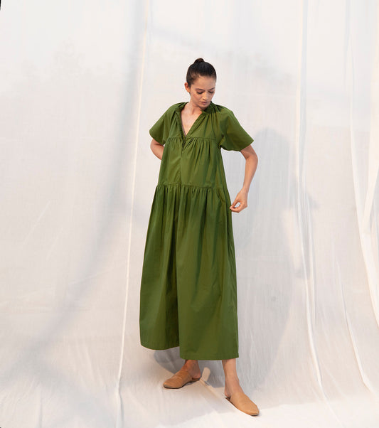 Green Midi Dress with pockets by Khara Kapas with Evening Wear, Green, Midi Dresses, Natural, Poplin, Regular Fit, Sienna by Khara Kapas, Solid Selfmade, Solids, Tiered Dresses, Womenswear at Kamakhyaa for sustainable fashion