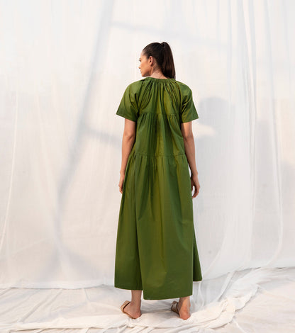 Green Midi Dress with pockets at Kamakhyaa by Khara Kapas. This item is Evening Wear, Green, Midi Dresses, Natural, Poplin, Regular Fit, Sienna KK, Solid Selfmade, Solids, Tiered Dresses, Womenswear