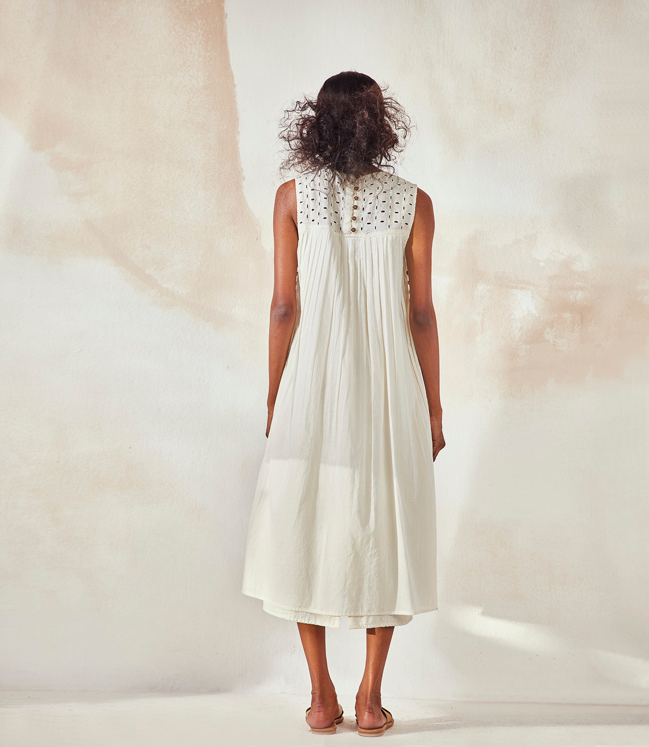Ivory Sleeveless Dress at Kamakhyaa by Khara Kapas. This item is Best Selling, Endless Summer, Midi Dresses, Mulmul, Natural, Regular Fit, Resort Wear, Sleeveless Dresses, Solids, White, Womenswear