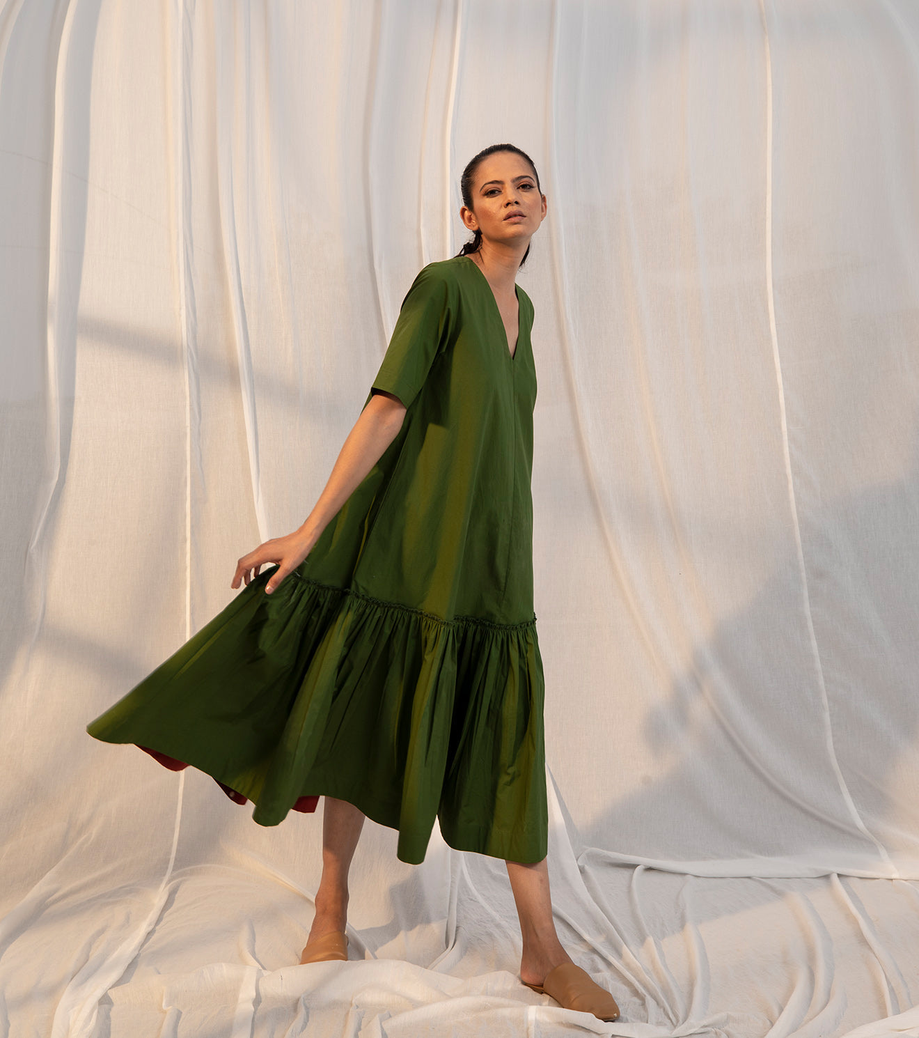 Green Tiered Midi Dress by Khara Kapas with Evening Wear, Green, Midi Dresses, Natural, Poplin, Regular Fit, Sienna by Khara Kapas, Solid Selfmade, Solids, Tiered Dresses, Womenswear at Kamakhyaa for sustainable fashion
