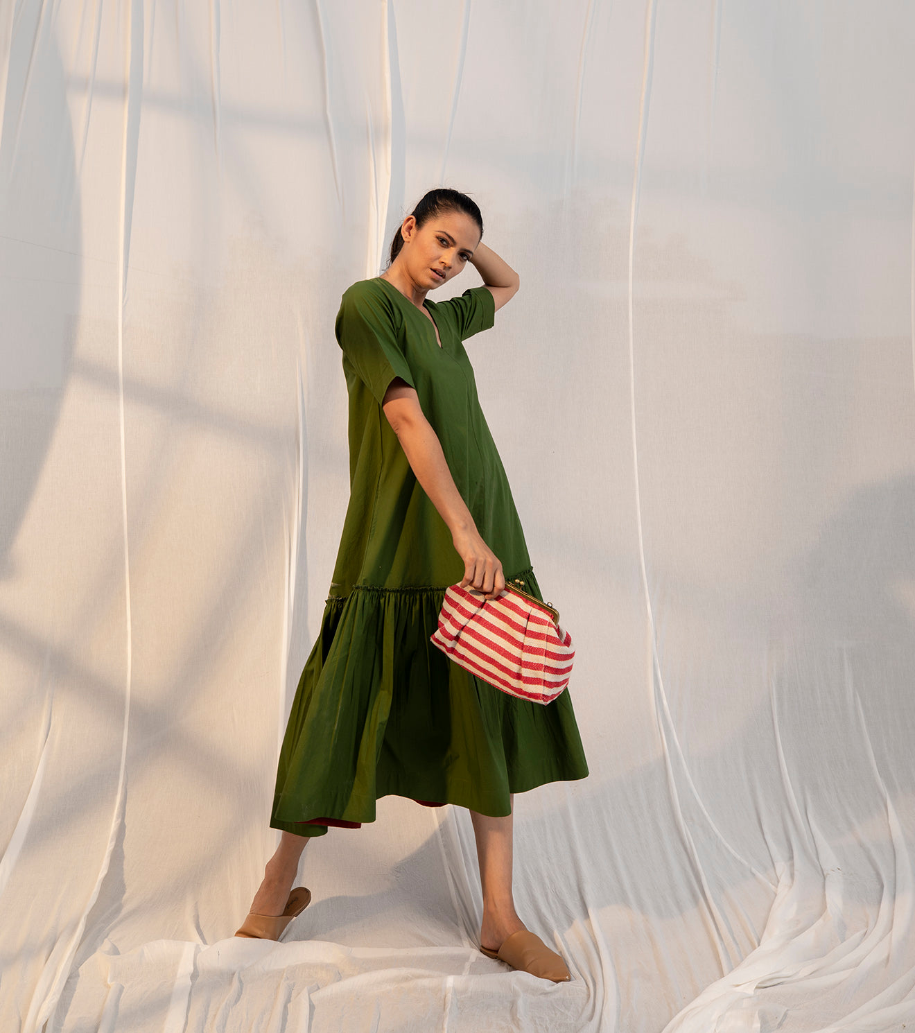 Green Tiered Midi Dress by Khara Kapas with Evening Wear, Green, Midi Dresses, Natural, Poplin, Regular Fit, Sienna by Khara Kapas, Solid Selfmade, Solids, Tiered Dresses, Womenswear at Kamakhyaa for sustainable fashion
