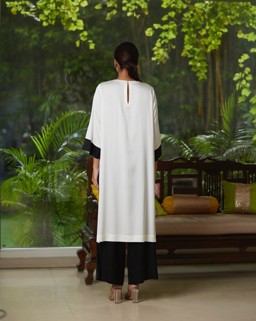 White And Black Satin Silk Kurta Pant Set by Mayura Kumar with Black, Casual Wear, Festive Wear, Kurta Pant Sets, Mayura Kumar, Regular Fit, Satin, Silk, Solids, Timeless Elegance, White, Womenswear at Kamakhyaa for sustainable fashion